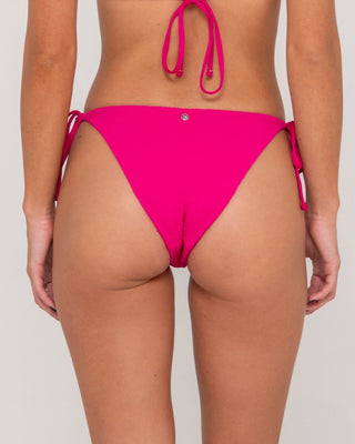 Woman wearing Sandalwood Midi Side Ties Bikini Bottom in Fuchsia