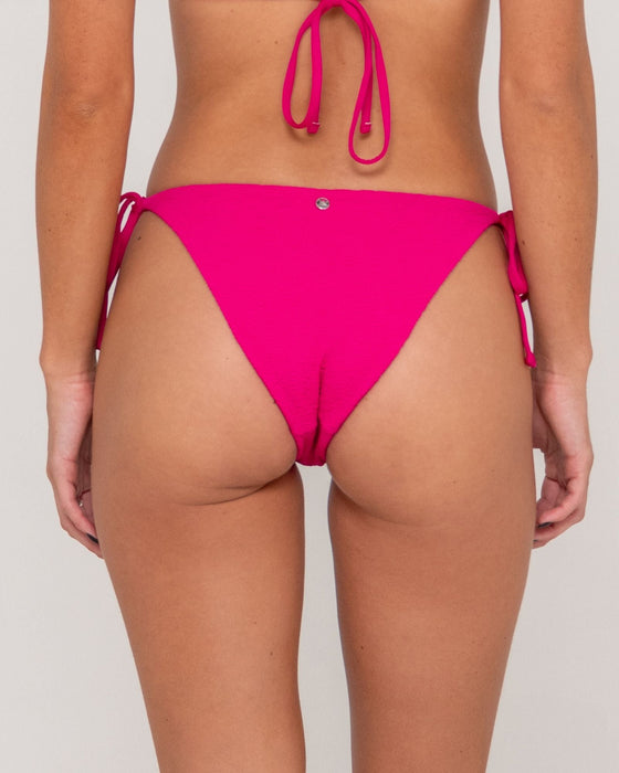 woman-wearing-sandalwood-midi-side-ties-bikini-bottom-in-fuchsia