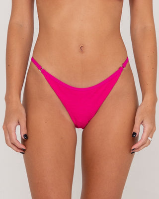Woman wearing Sandalwood Ring Cheeky Bikini Bottom in Fuchsia