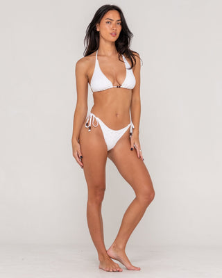 Woman wearing Elysian Halter Bikini Top in Bright White
