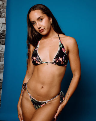 Woman wearing Heidi Floral Halter Bikini Top in Black