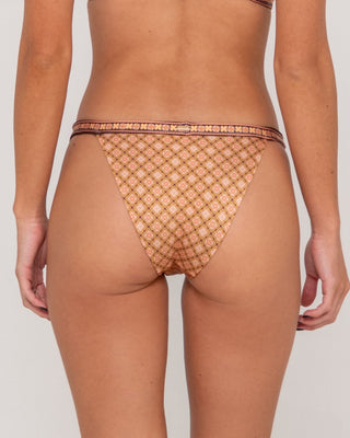 Woman wearing Georgie Geo Midi Bikini Bottom in Sunset Orange