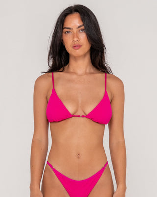 Woman wearing Sandalwood Ring Bikini Top in Fuchsia