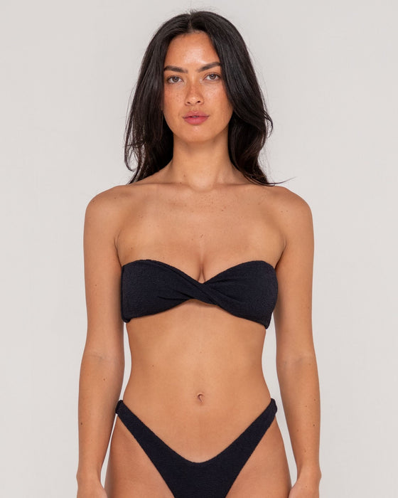 woman-wearing-sandalwood-bandeau-twist-bikini-top-in-black