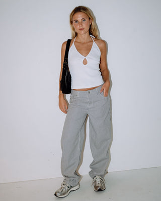 woman-wearing-emma-cut-out-skimmer-tank-in-white