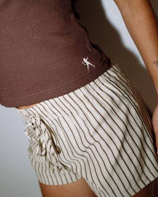 Woman wearing Zoe One Shoulder Tank in Java