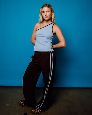 Woman wearing Zoe One Shoulder Tank in Retro Blue