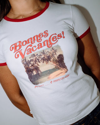 Woman wearing Bonnes Vacances Ringer Baby Tee in White