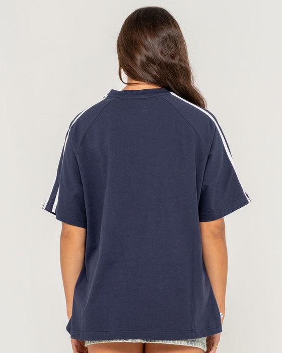woman-wearing-all-saint-collegiate-og-oversize-tee-in-navy-blue