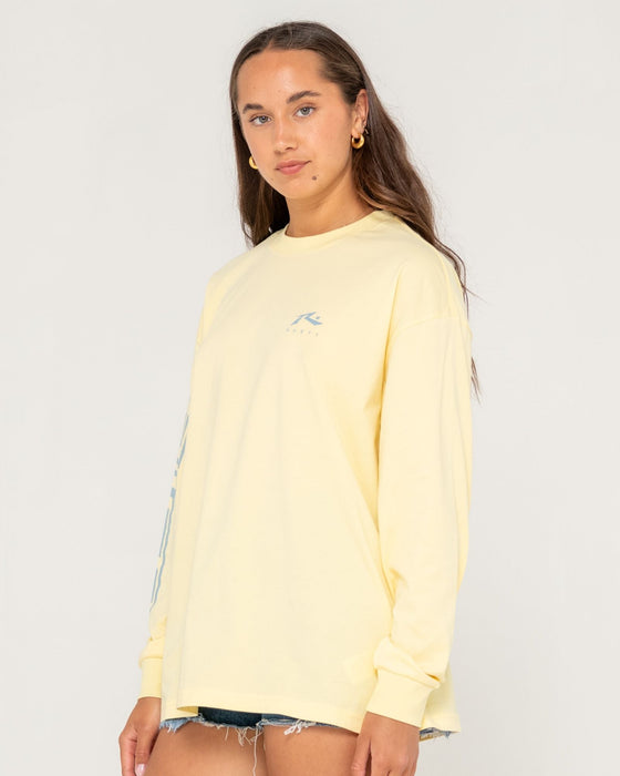 woman-wearing-play-it-safe-l-s-tee-in-pale-banana