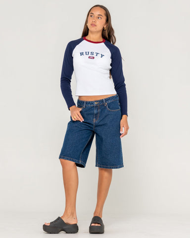 Woman wearing Mr Worldwide Long Sleeve Baby Tee in White - long sleeve graphic tee, fitted long sleeve