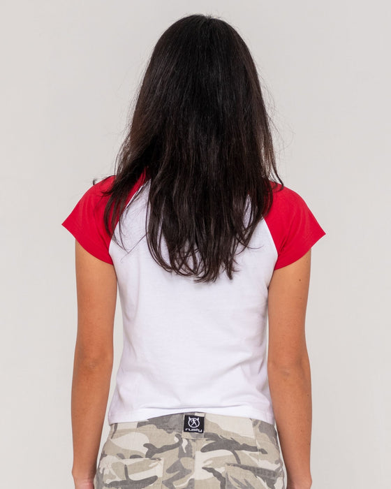 woman-wearing-daring-devil-cap-sleeve-baby-tee-in-white