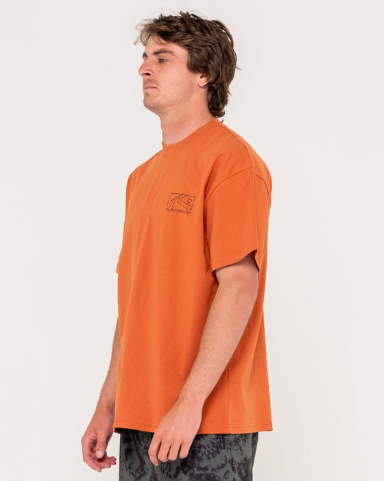 man-wearing-boxed-out-short-sleeve-tee-in-burnt-orange