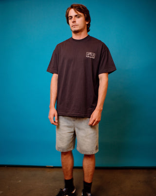 Man wearing Boxed Out Short Sleeve Tee in Navy Blue