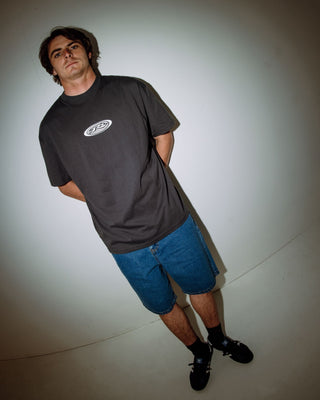 Man wearing Irie Eye Short Sleeve Tee in Carbon