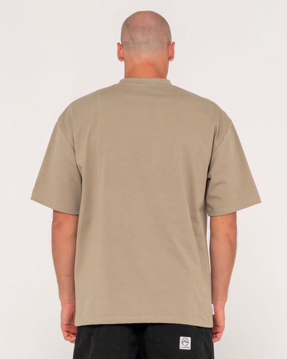 man-wearing-steezey-short-sleeve-heavy-tee-in-khaki