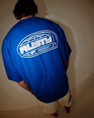 Man wearing Outer There Short Sleeve Heavy Tee in Royal Blue