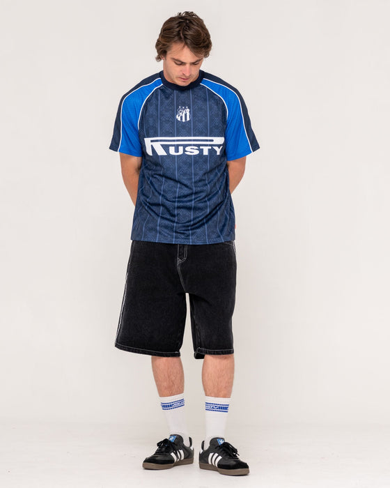 man-wearing-frenetic-short-sleeve-tee-in-navy-blue