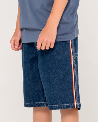 Boy wearing Flip Daddy Jort Boys - Deep Sea Blue in Deep Sea Blue / Orange