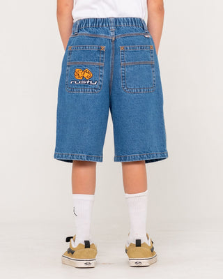 Boy wearing Flip Daddy Low Ballin Jort Boys in Middy Blue