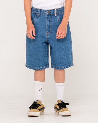 Boy wearing Flip Daddy Low Ballin Jort Boys in Middy Blue