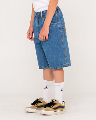 Boy wearing Flip Daddy Low Ballin Jort Boys in Middy Blue