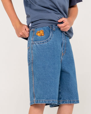 Boy wearing Flip Daddy Low Ballin Jort Boys in Middy Blue