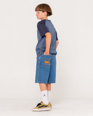 Boy wearing Flip Daddy Low Ballin Jort Boys in Middy Blue