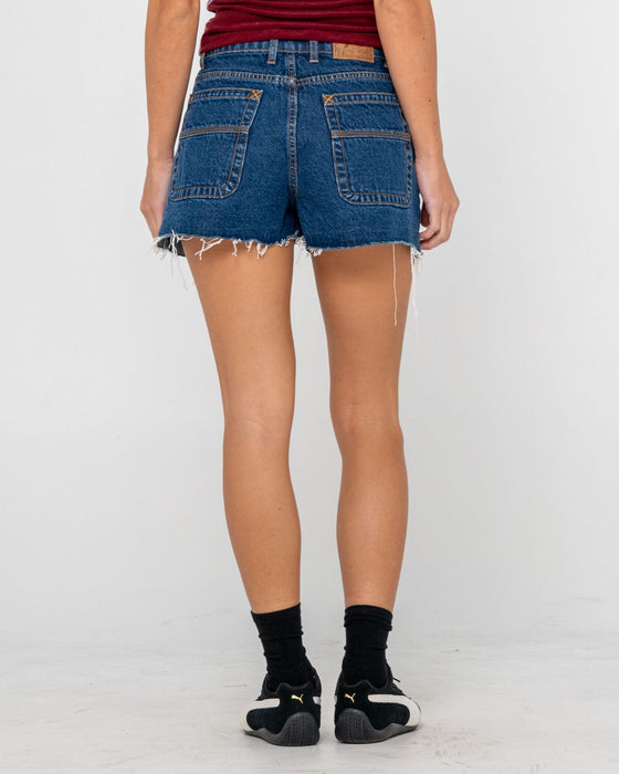 woman-wearing-penny-kick-flare-denim-short-in-deep-sea-blue