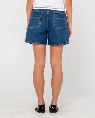 Woman wearing Cyprus High Denim Short in Deep Sea Blue
