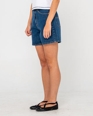 Woman wearing Cyprus High Denim Short in Deep Sea Blue