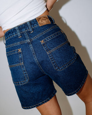 Woman wearing Cyprus High Denim Short in Deep Sea Blue