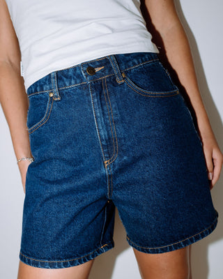 Woman wearing Cyprus High Denim Short in Deep Sea Blue