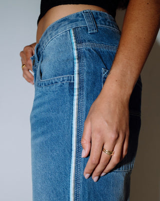 Woman wearing Flip Mommy Low Rise Wide Leg Denim Jort in Blasted Middy Blue / Blue