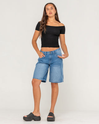 Woman wearing Flip Mommy Low Rise Wide Leg Denim Jort in Blasted Middy Blue / Blue