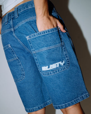 Woman wearing Flip Mommy Tapeless Low Rise Denim Short in Middy Blue