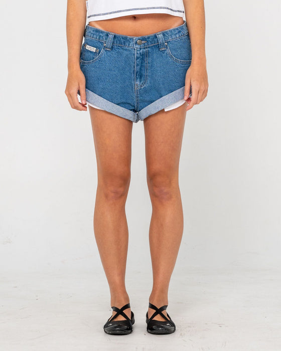 woman-wearing-pheonix-low-rise-denim-mini-short-in-middy-blue