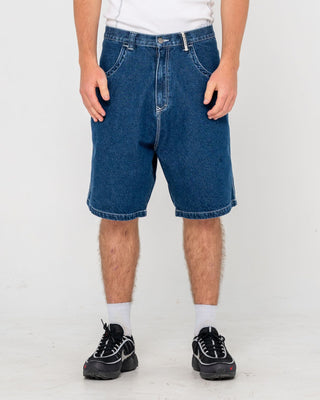 Man wearing Flip Daddy Tapeless Jort - Deep Sea Blue in Deep Sea Blue