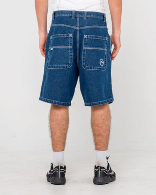 Man wearing Flip Daddy Tapeless Jort - Deep Sea Blue in Deep Sea Blue