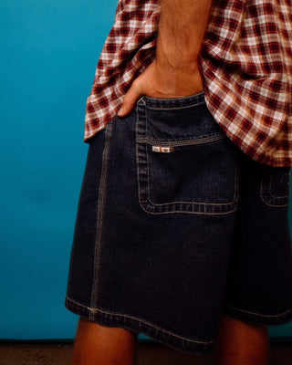 Man wearing Flip Daddy Tapeless Jort - Deep Sea Blue in Deep Sea Blue