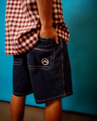 Man wearing Flip Daddy Tapeless Jort - Deep Sea Blue in Deep Sea Blue