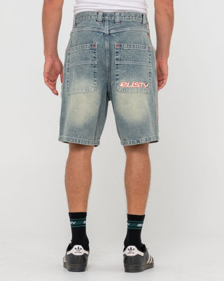 Man wearing Flip Daddy 2.0 Jort - Dirty Dawg in Dirty Dawg / Orange