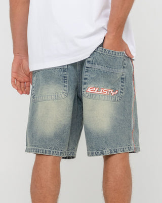 Man wearing Flip Daddy 2.0 Jort - Dirty Dawg in Dirty Dawg / Orange