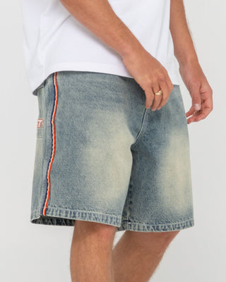 Man wearing Flip Daddy 2.0 Jort - Dirty Dawg in Dirty Dawg / Orange