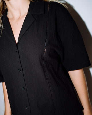 Woman wearing Rummer Has It Short Sleeved Shirt in Black