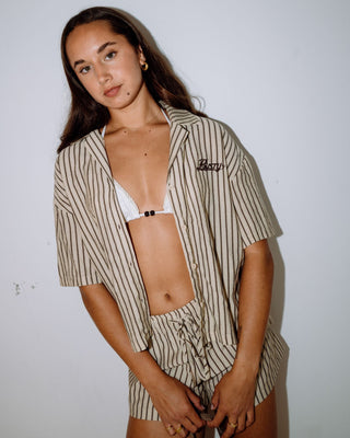 Woman wearing Sandy Stripe Short Sleeved Shirt in Oatmeal Stripe