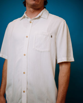 Man wearing Overtone Short Sleeve Linen Shirt in Whisper White
