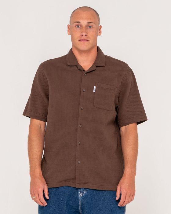 man-wearing-canseco-vacation-short-sleeve-shirt-in-pinecone