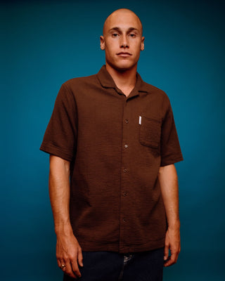 Man wearing Canseco Vacation Short Sleeve Shirt in Pinecone