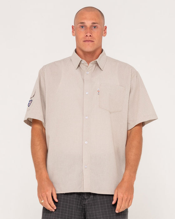 man-wearing-stasha-pocket-short-sleeve-shirt-in-light-khaki